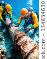 Underwater pipeline repair: Two divers meticulously inspect and seal a rusty underwater pipeline, ensuring structural integrity and preventing leaks 134834630