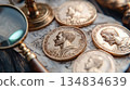 Ancient Roman gold coins, a magnifying glass, and antique objects rest on an aged parchment, evoking a sense of historical discovery and exploration 134834639