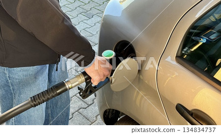 Refueling Car at Gas Station, Fuel Pump Nozzle in Vehicle Fuel Tank Refueling Car at Gas Station, Fuel Pump Nozzle in Vehicle Fuel Tank 134834737