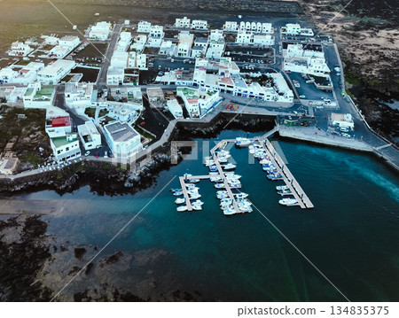 Beautiful town among black lava formations, volcanic landscapes on the coast of the Atlantic Ocean. 134835375