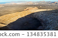 A volcano crater, beautiful volcanic mountains of Lanzarote, Canary islands at sunset. 134835381