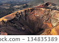 A beautiful view of a volcano crater, desert, mountains and volcanoes on the Lanzarote island. 134835389