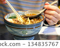 Eating warm and delicious udon noodles 134835767
