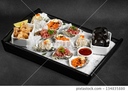 Healthy food. Seafood and toast in a frying pan on a wooden board on a black background. Healthy food. Seafood and toast in a frying pan on a wooden board on a black background. 134835880