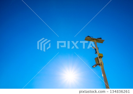 Yokohama cityscape in Japan: Security cameras on street corners. Looking at security cameras shining against the blue sky and sunlight... a new era - Yokohama city 134836261
