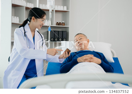 Doctors explaining the symptoms to a patient in a hospital or therapeutic treat client Professional medical service concept. Doctors explaining the symptoms to a patient in a hospital or therapeutic treat client Professional medical service concept. 134837552
