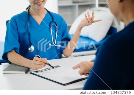 Doctors explain the use of medication to patients. healthcare and medical concept. Doctors explain the use of medication to patients. healthcare and medical concept. 134837579