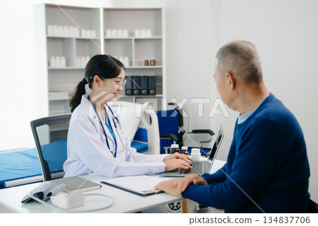 Asian female hands touching old male hand Helping hands take care of the elderly concept 134837706
