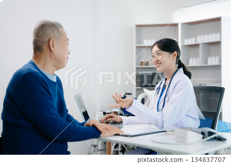 Asian female hands touching old male hand Helping hands take care of the elderly concept 134837707