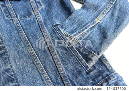 sleeve of blue denim shirt texture isolated on white background, jean fashion style sleeve of blue denim shirt texture isolated on white background, jean fashion style 134837800