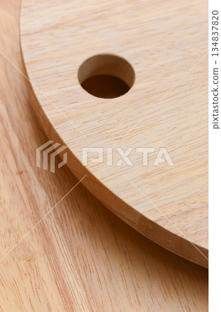 brown wooden sphere cuttingboard wood background 134837820