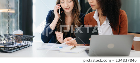 Business colleague business presents and explains and using laptop and tablet. Teamwork, financial marketing team, Business colleague business presents and explains and using laptop and tablet. Teamwork, financial marketing team, 134837846