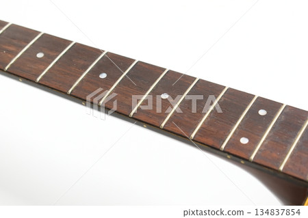 part of brown wood acoustic guitar isolated on white background 134837854