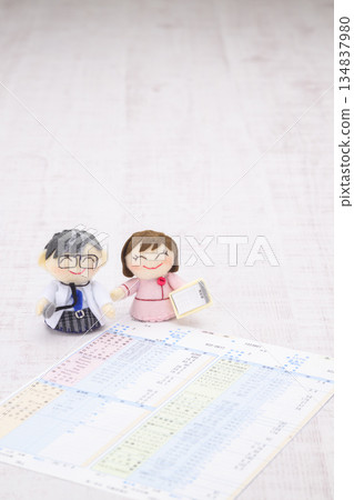 Doctor and nurse dolls and medical examination result form 134837980