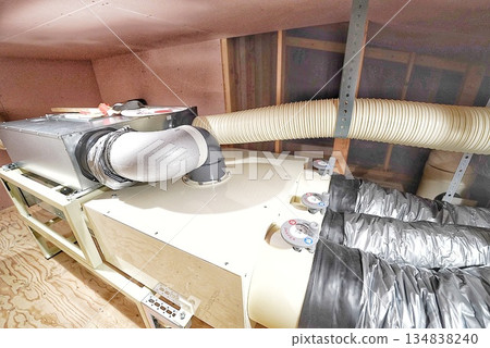 Construction of a new house with a large air conditioning unit in the attic 134838240