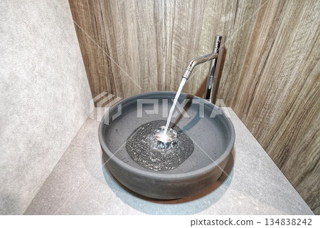 Compact hand washing basin in the toilet Compact hand washing basin in the toilet 134838242
