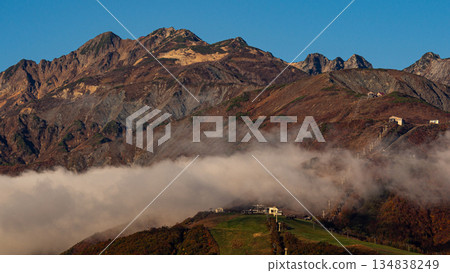 The Northern Alps appearing between the clouds in Hakuba Village, Nagano Prefecture The Northern Alps appearing between the clouds in Hakuba Village, Nagano Prefecture 134838249