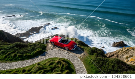 Classic Red Convertible Car Parked on Coastal Cliffside Path Overlooking Crashing Ocean Waves 134838601