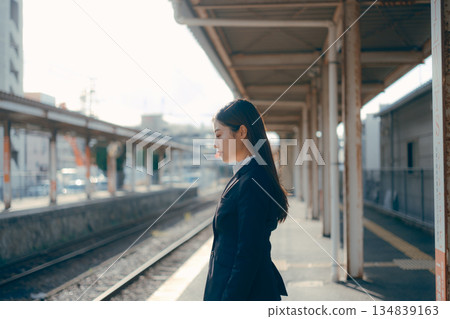 Japanese female university student standing on the station platform 134839163