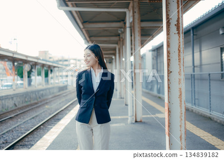 Japanese female university student standing on the station platform 134839182