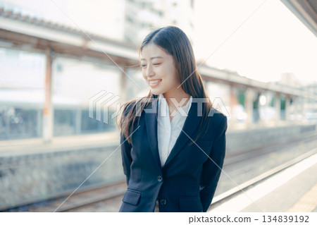 Japanese female university student standing on the station platform 134839192