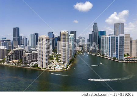 Brickell skyline and Biscayne Bay in Miami, Florida. Yacht boat tour. Luxury vacation on summer with motorboat sailing at sea. Boat motor aerial. Aerial view on Miami with skyscraper 134839202