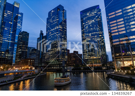Business city. Night cityscape of Chicago skyscraper building. Chicago architecture of skyscraper. City night illuminated building. Skyscraper cityscape. Night city of Chicago. Nighttime city 134839267