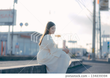 Japanese female university student standing on the street Japanese female university student standing on the street 134839394