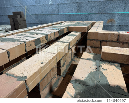 Fresh brickwork of a heating stove firebox. Close-up. 134840697