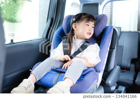 Girl sitting in a child seat 134841166