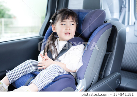 Girl sitting in a child seat 134841191