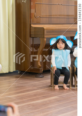 A Japanese girl toddler participating in a nursery school play A Japanese girl toddler participating in a nursery school play 134841530