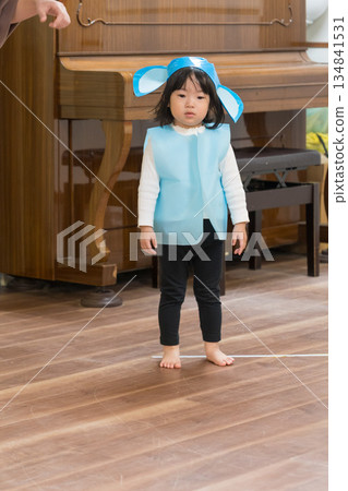 A Japanese girl toddler participating in a nursery school play A Japanese girl toddler participating in a nursery school play 134841531