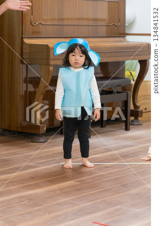 A Japanese girl toddler participating in a nursery school play A Japanese girl toddler participating in a nursery school play 134841532