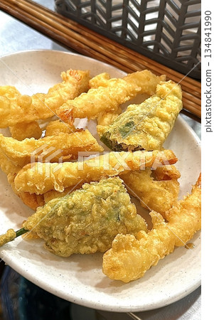 Crispy and delicious Twigim, Korean-style tempura with a variety of ingredients like vegetables and seafood, deep-fried to perfection. Enjoyed as a flavorful, crunchy street food. Crispy and delicious Twigim, Korean-style tempura with a variety of ingredients like vegetables and seafood, deep-fried to perfection. Enjoyed as a flavorful, crunchy street food. 134841990