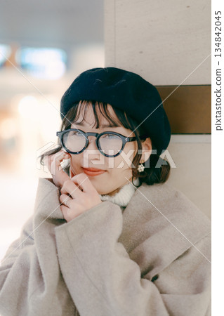 A woman in her 30s lost in thought while waiting for an appointment 134842045