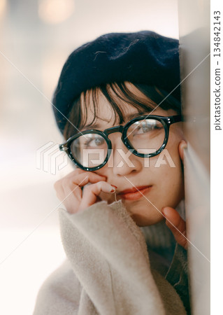 A simple portrait of a woman in her 30s standing A simple portrait of a woman in her 30s standing 134842143