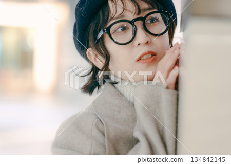 A simple portrait of a woman in her 30s standing 134842145