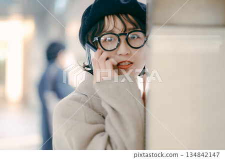 A simple portrait of a woman in her 30s standing A simple portrait of a woman in her 30s standing 134842147