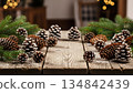 Rustic Christmas Pinecones and Evergreen Branches on Wooden Table 134842439