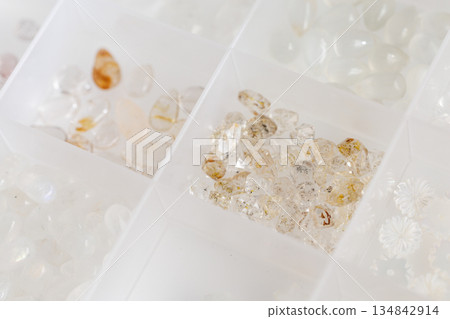 Natural loose stone set in a case for organization and storage. Rutilated quartz gemstones. Handmade. Natural loose stone set in a case for organization and storage. Rutilated quartz gemstones. Handmade. 134842914