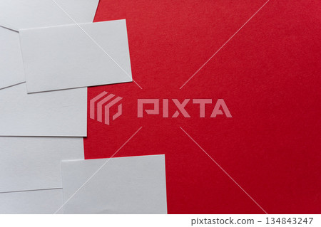 White card on a red background White card on a red background 134843247