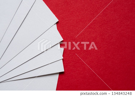White card on a red background 134843248
