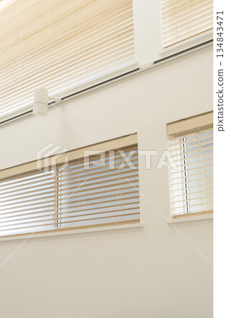 Living room with wooden blinds and indirect lighting Living room with wooden blinds and indirect lighting 134843471