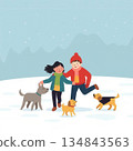 Happy Couple Walking with Dogs in Winter Snow Landscape with Mountains and Falling Snowflakes 134843563