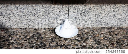 Purifying salt placed at the entrance 134843568