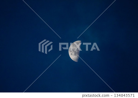 Half moon floating in the autumn night sky in November 04 Half moon floating in the autumn night sky in November 04 134843571