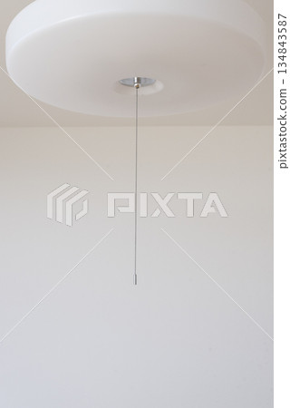 Close-up of the corded ceiling light switch Close-up of the corded ceiling light switch 134843587