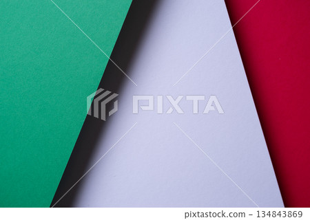 Overlapping green, red, and white construction paper Overlapping green, red, and white construction paper 134843869