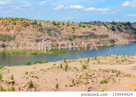 View of the lake at abandoned quarry on summer View of the lake at abandoned quarry on summer 134844024